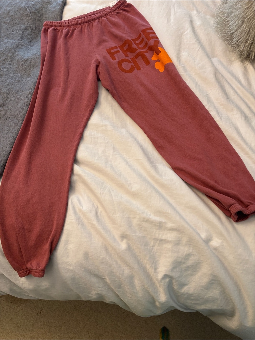 freecity dusty rose sweatpants with orange logo